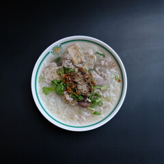 rice noodles in white clear soup topped