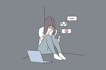 Depression, frustration, mental stress, media concept. Young derpessed frustrated woman girl teenager sitting on floor with smartphone reading messages. Suffering from cyverbullying in social network.