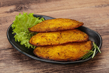 Baked potato with herbs and spices