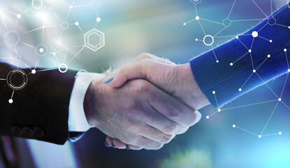 Business agreement with handshake, light effect; light effect