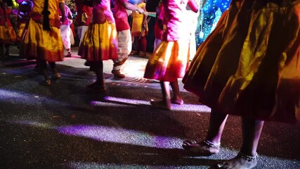 Focus leg of stick dancer at street during Thaipusam.