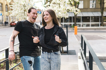Young cheerful couple during a date outdoors