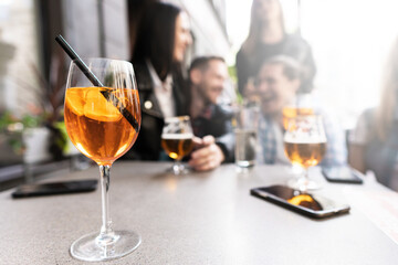 Aperol Spritz cocktail on a table in a city bar