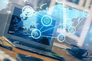 Computer on desktop with social network theme icon. Multi exposure. Concept of international connections.