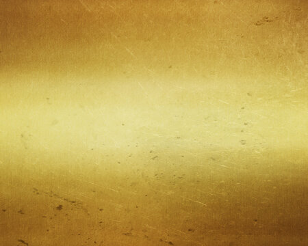 Gold metal background with polished, brushed texture for design.