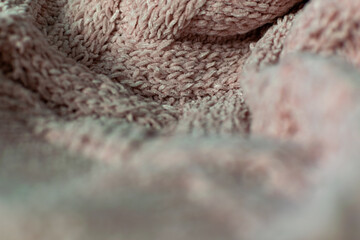 Fine textured and voluminous fabric in pink. Embossed textile pattern, pleasant to the touch and delicate, velvety and textured background for design and decoration