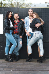 Two stylish couples on a city street