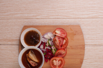 Cooking ingredient,on a chop board,isolated over wooden background