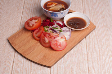 Cooking ingredient,on a chop board,isolated over wooden background