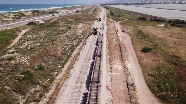 Repairing railway. Rail tracks maintenance process.