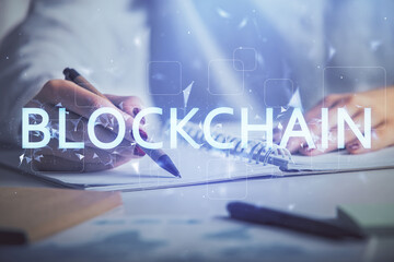 Fototapeta na wymiar Cryptocurrency hologram over woman's hands writing background. Concept of blockchain. Double exposure