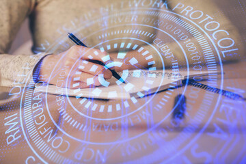 Double exposure of writing hand on background with data technology hologram. Big data concept.