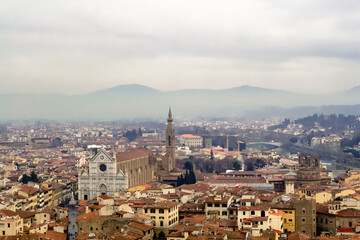 Fototapeta premium Florence, Italy. A birds eye view of the city landscape toward the church of Santa Croce shot from the Arnolfo's tower in the Palazzo Vecchio