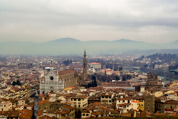 Obraz premium Florence, Italy. A birds eye view of the city landscape toward the church of Santa Croce shot from the Arnolfo's tower in the Palazzo Vecchio
