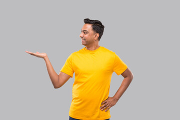 Indian Man Showing to Side Smilling Isolated.
