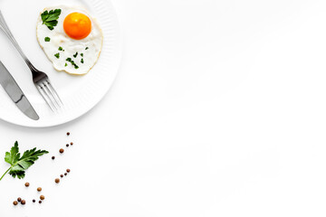 Fried eggs on plate - white desk top view space for text