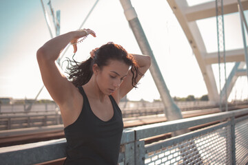 Woman runner tying her hair