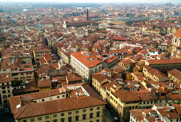 Florence, Italy. An aerial view of the city landscape seen from the bell tower of Santa Maria del Fiore church. Here you can see the train station surrounded by the typical red roofs of the town