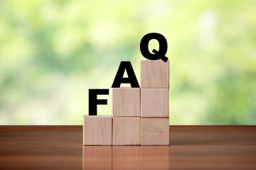 Wooden cube block shapes as step stairs with FAQ . Help concept, frequently asked questions