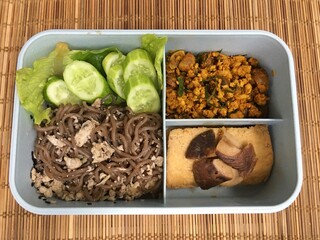 This lunch set includes Stir Fried Pork, fried tofu and seaweed noodles