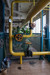 Steel industrial pipeline with valves and manometers in boiler room
