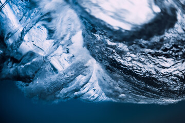 Underwater wave crashing in ocean. Transparent water underwater
