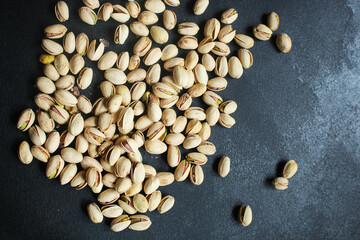pistachios tasty nuts snack Menu concept serving size. food background top view copy space for text organic healthy eating keto or paleo diet