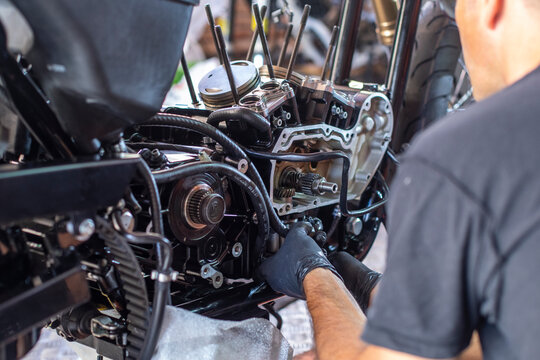 mechanic working on the repair of a motorcycle in the workshop