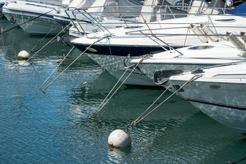 reflections of masts and boats at the geneva yacht club