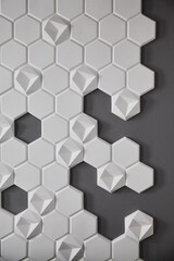 wall background. background texture. wall with textured hexagons. the honeycomb on the wall. gray wall