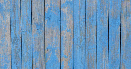 Fototapeta na wymiar Texture of shabby old blue wooden boards