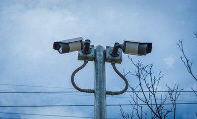 Technician installing CCTV camera for security