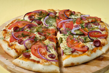 Tasty sliced Pizza with mozzarella, tomatoes, onion   and sausages. Delicious Italian food. Cafe, pizzeria and restaurant menu.
