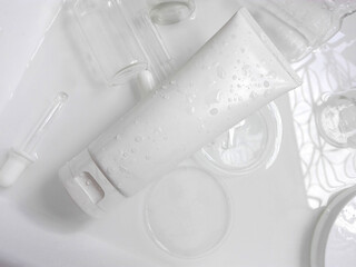 beauty treatment medical skincare and cosmetic lotion cream serum oil mockup bottle packaging product on water splash background in healthcare and medicine