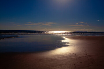 Fototapeta premium Night tide in the moonlight . Ocean coast illuminated by the moon 