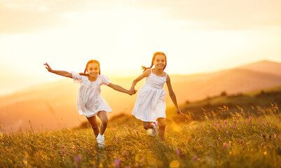 happy children run in nature in summer.