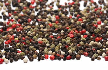 Colorful peppercorn mix, pepper pile isolated on white background