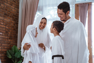 muslim umrah and hajj with family showing passport