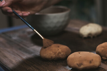 cooking potato cake on a dark wooden background. cooking rum ball