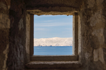 View from a loopholes of Nehaj fortress on the coast of the island of Krk.