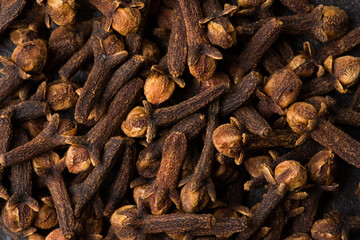 Fototapeta premium Clove spice as background texture closeup. Macro