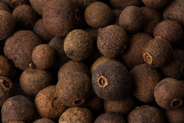Allspice, as background texture close-up. Macro