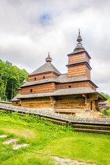 Fototapeta na wymiar View at the Wooden church Church of St.Nicholas from Mikulasova in Bardejovske kupele town, Slovakia