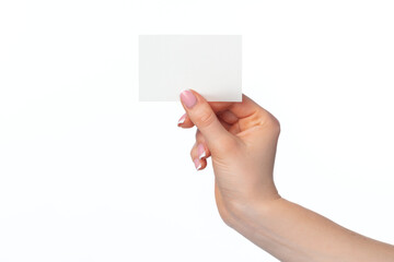 Fototapeta premium Female hand with blank white business card isolated on white