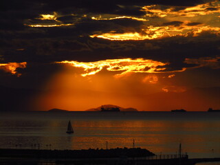A beautiful sunset by the sea under a cloudy sky 