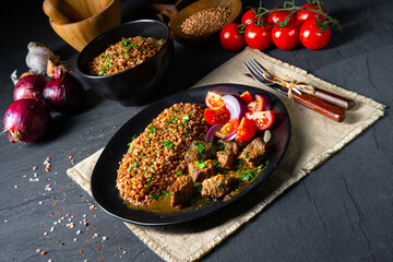 Buckwheat groats baked in the oven with beef goulash