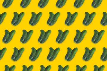 Pattern of ugly cucumbers on a yellow background