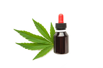 Hemp oil and cannabis leaf isolated on white background. Healthy cannabis oil.