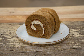 Coffee roll cake placed on a wooden table