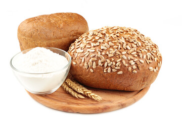 Wheat flour and bread isolated on white background